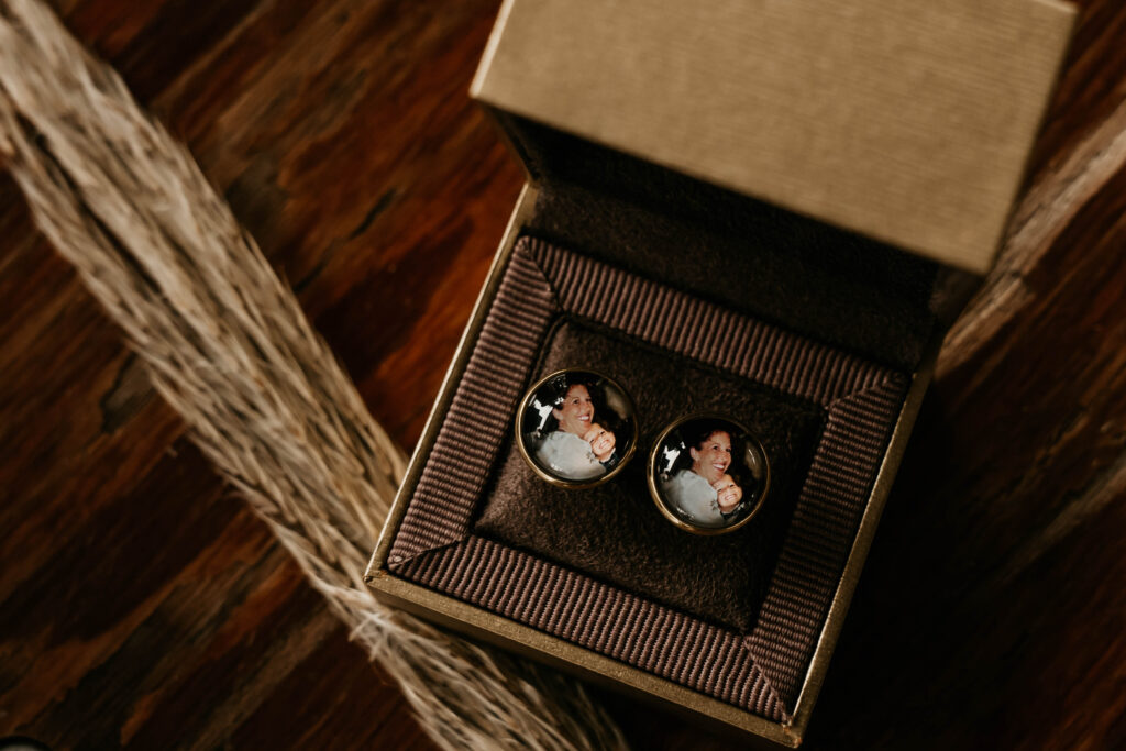 groom's cufflinks with a picture of his mother on them that his wife gifted him on their wedding day